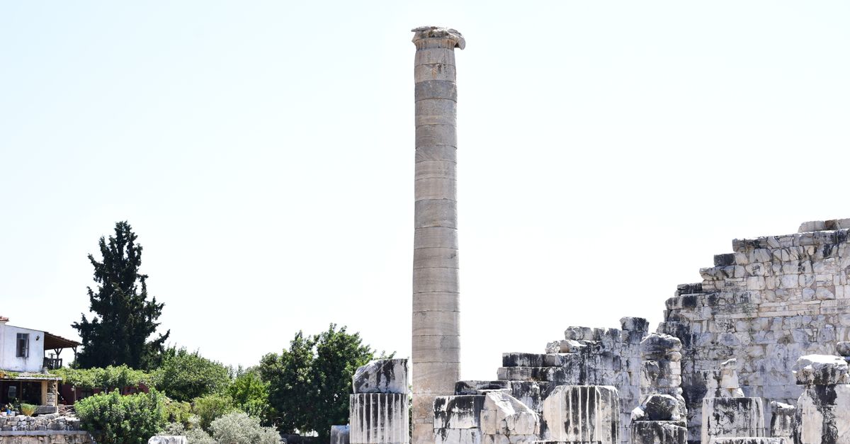 Explore the historic ancient ruins with distinctive marble columns and stone architecture.
